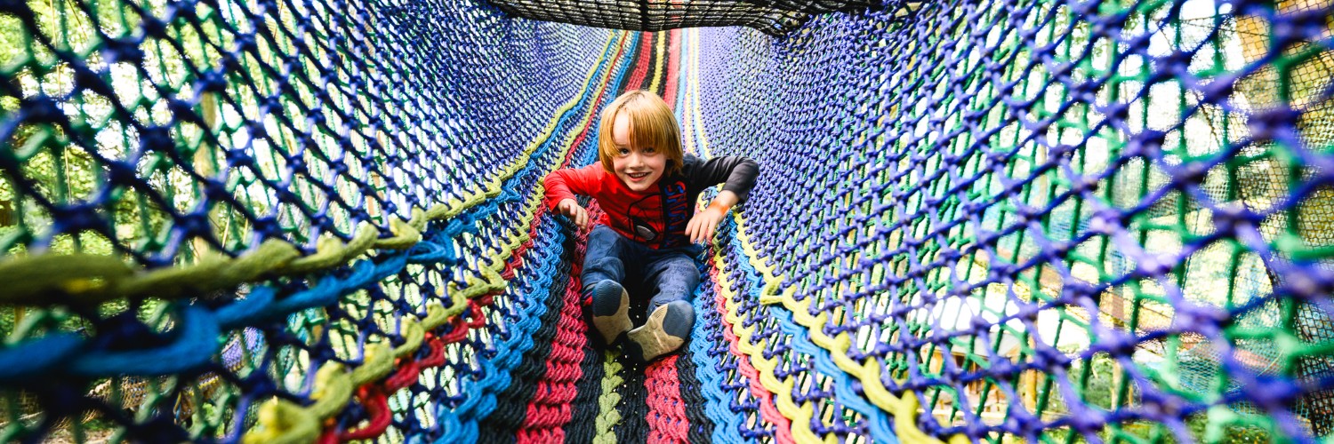 Child on the ropes course at Zip World Windermere